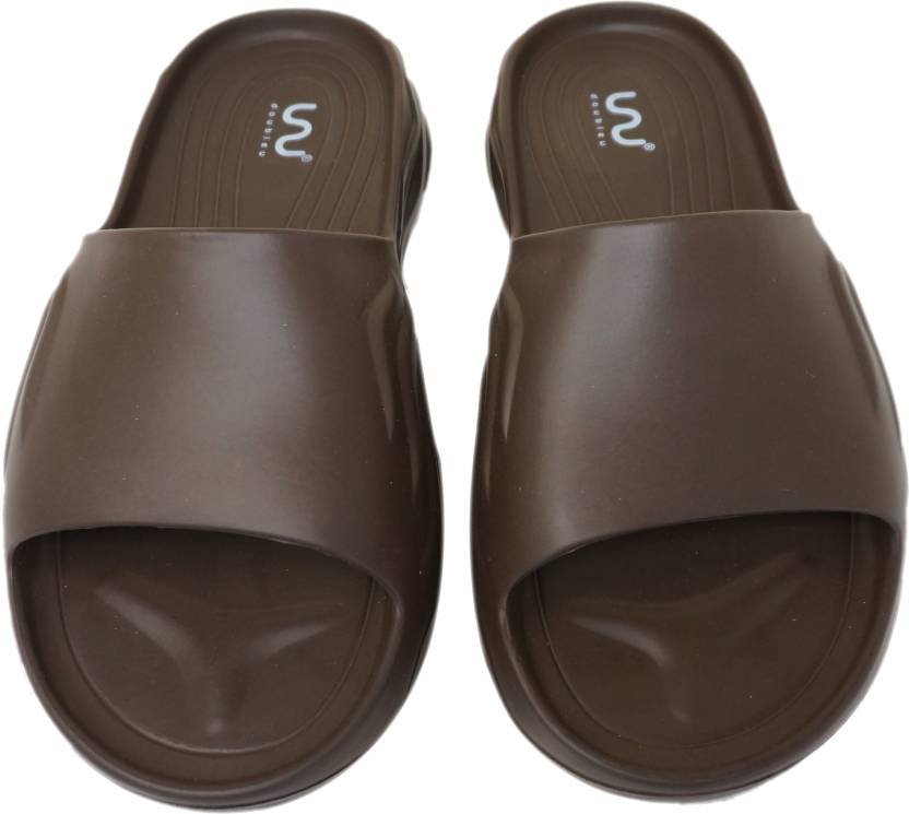 Doubleu Slide displayed from various angles, featuring adjustable straps, cushioned footbed, and stylish design