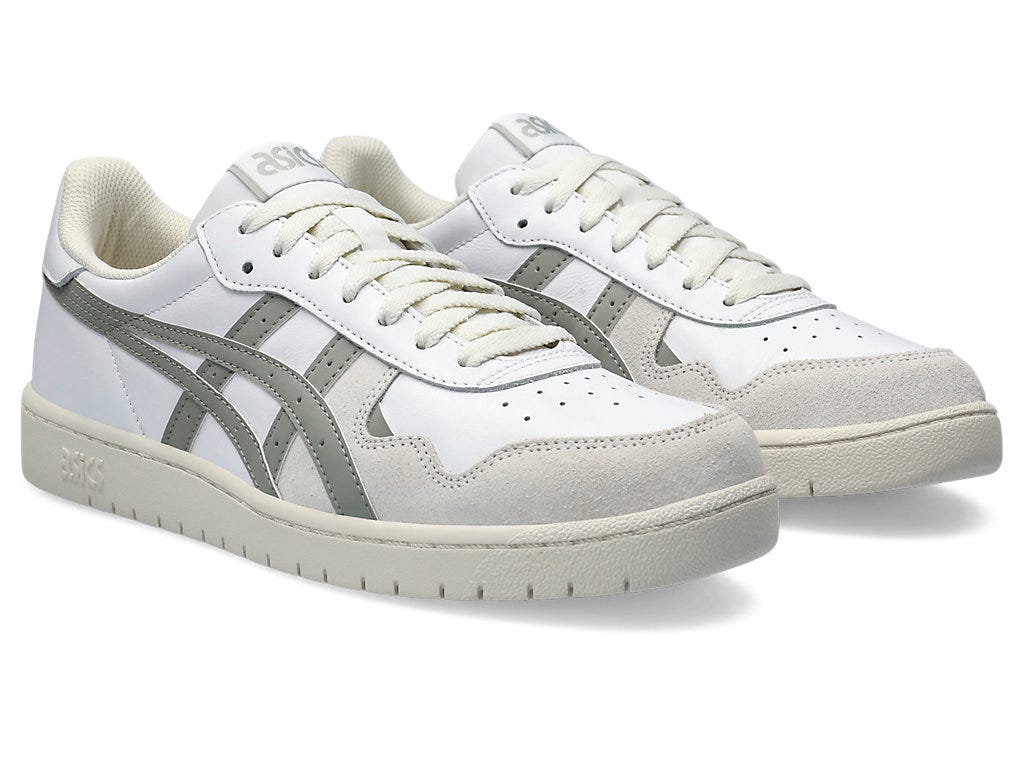 Side view showcasing the clean silhouette, lace-up detail, and textured outsole.