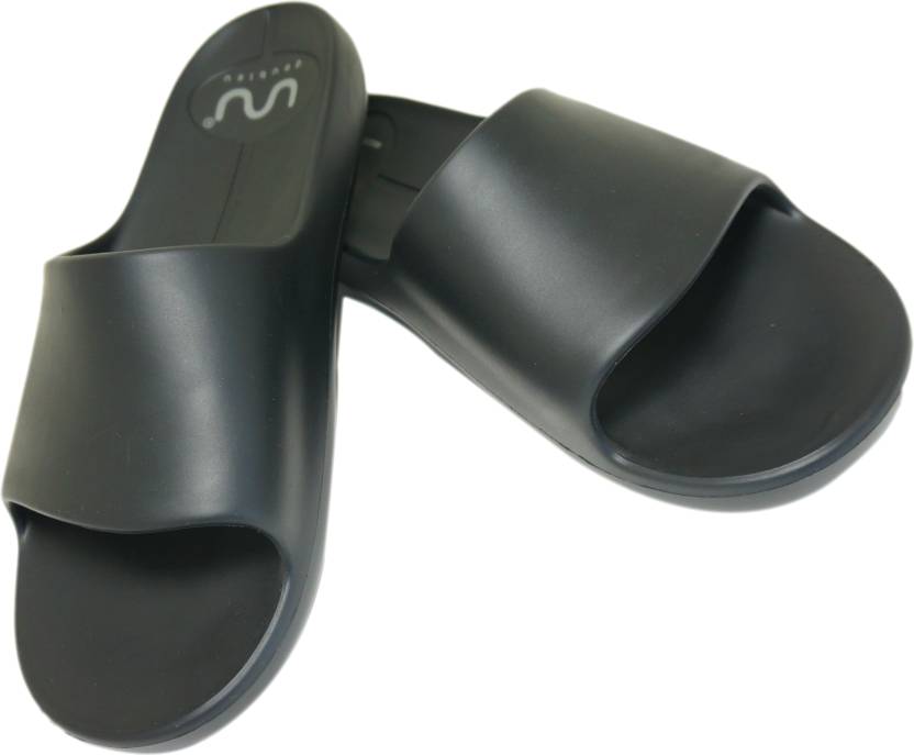 Doubleu Slide displayed from various angles, featuring adjustable straps, cushioned footbed, and stylish design