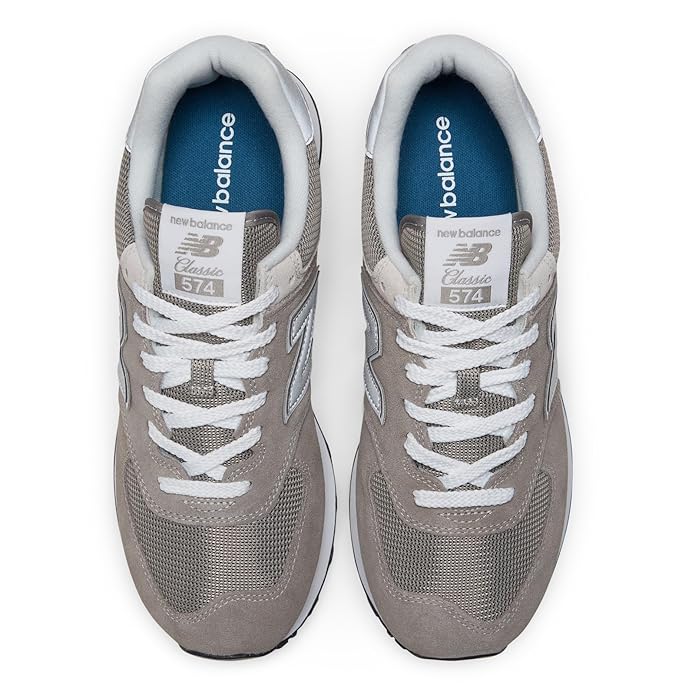A side-angle view of New Balance men's lifestyle shoes showcasing the retro basketball-inspired design durable leather upper lace-up closure and premium craftsmanship placed on a clean background to highlight their unique features.