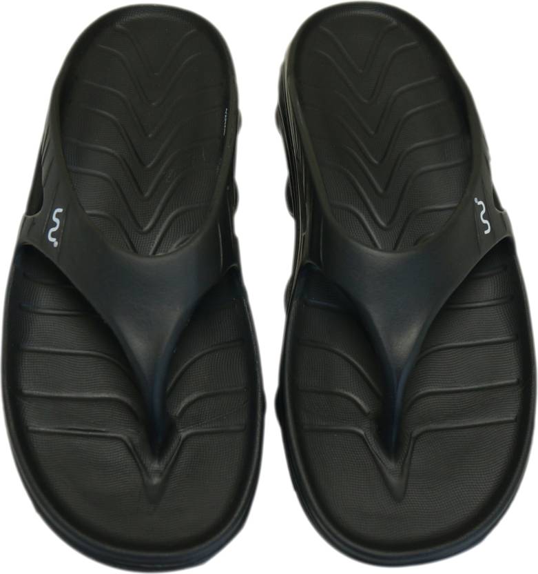 Doubleu Slipper displayed from various angles, featuring adjustable straps, cushioned footbed, and stylish design