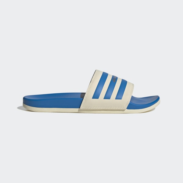 A pair of Adidas Adilette Comfort Men’s Slides showing off the sleek design and cushioned footbed ideal for casual wear and post-workout relaxation