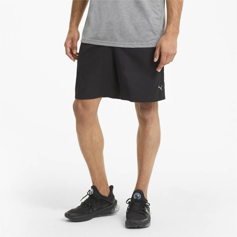 Side view of PUMA Men's Shorts, highlighting the relaxed fit, soft fabric, and signature PUMA logo for a comfortable and stylish casual look.