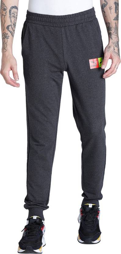 Side view of PUMA Men's Lower, showcasing its relaxed fit, breathable fabric, and signature PUMA logo for a casual, comfortable look.