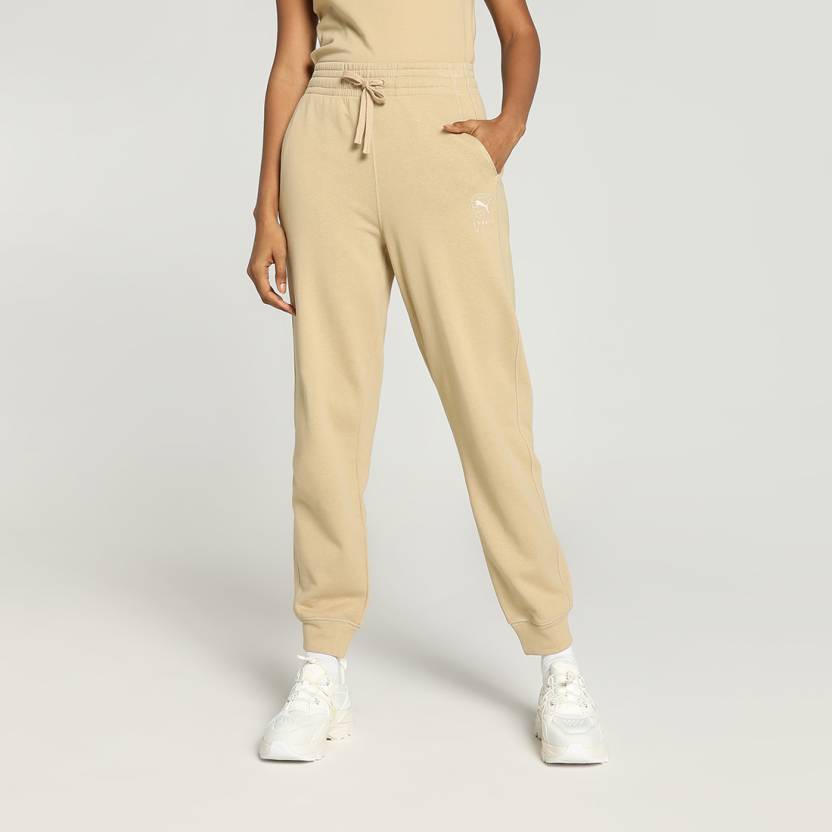 Side view of PUMA Women's Lower, highlighting the relaxed fit, soft fabric, and signature PUMA logo, perfect for casual wear and lifestyle activities.