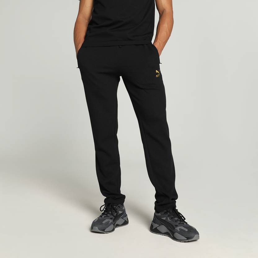 Side view of PUMA Men's Lower, showcasing its relaxed fit, breathable fabric, and signature PUMA logo for a casual, comfortable look.