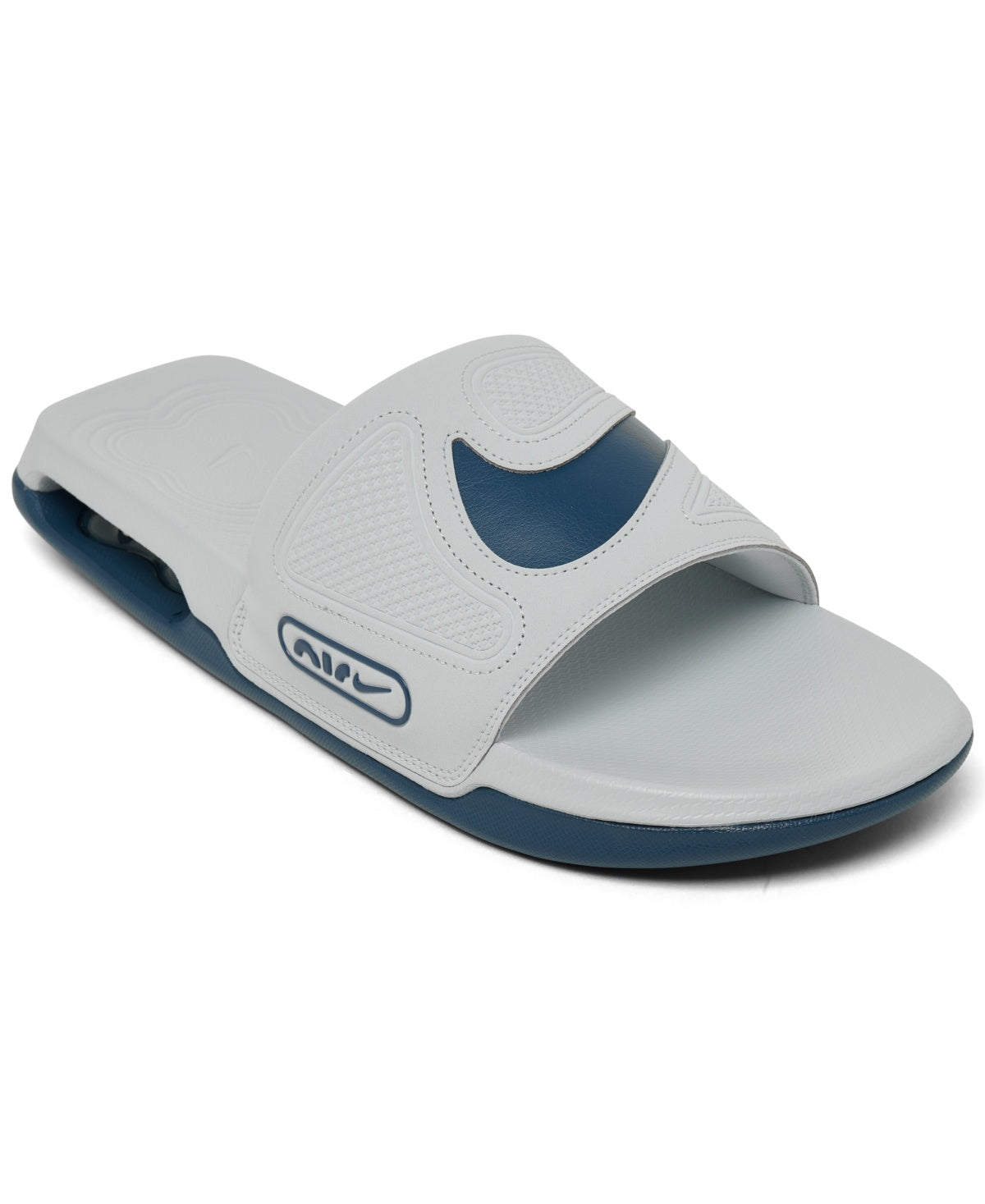 The image shows a pair of men’s Nike slide sandals, emphasizing their cushioned footbed and sleek strap design for a comfortable and casual fit.