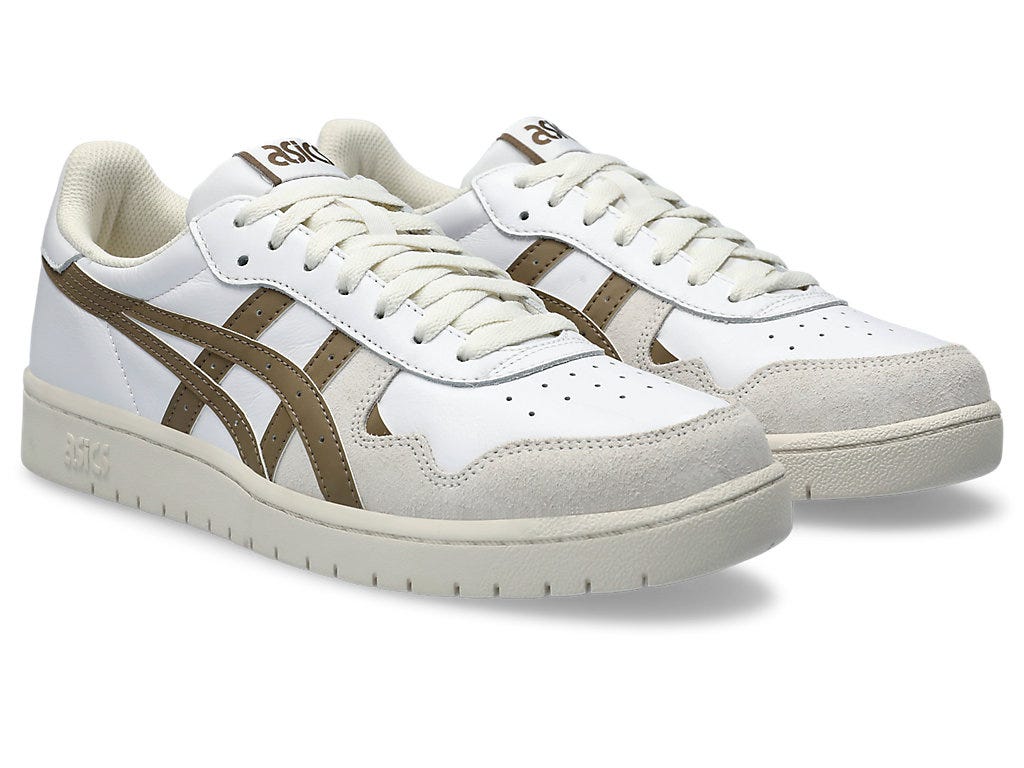 Side view showcasing the clean silhouette, lace-up detail, and textured outsole.