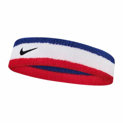 The image shows a unisex Nike headband worn on the head, showcasing its sleek, functional design and secure fit.