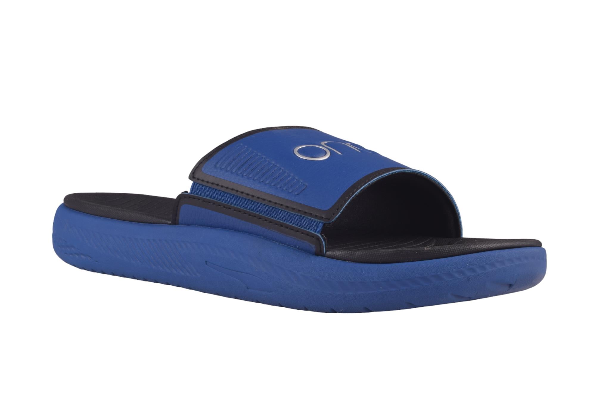 Side view of PUMA Men's Slippers, showcasing the soft plush interior, non-slip outsole, and iconic PUMA logo, designed for comfort and stability during indoor wear.