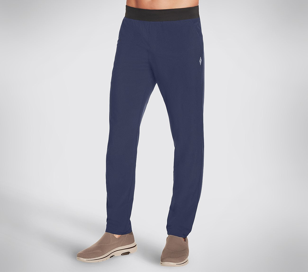 Side view of Skechers GO WALK Action Pant Men's lower active pants featuring functional design and sleek fit