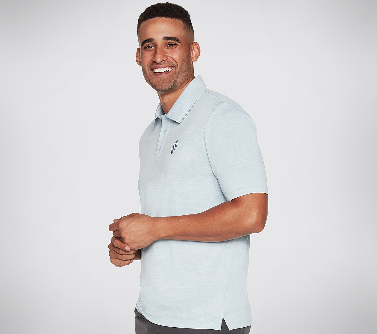 Side view of Skechers On The Road Men's polo with modern design and breathable fabric