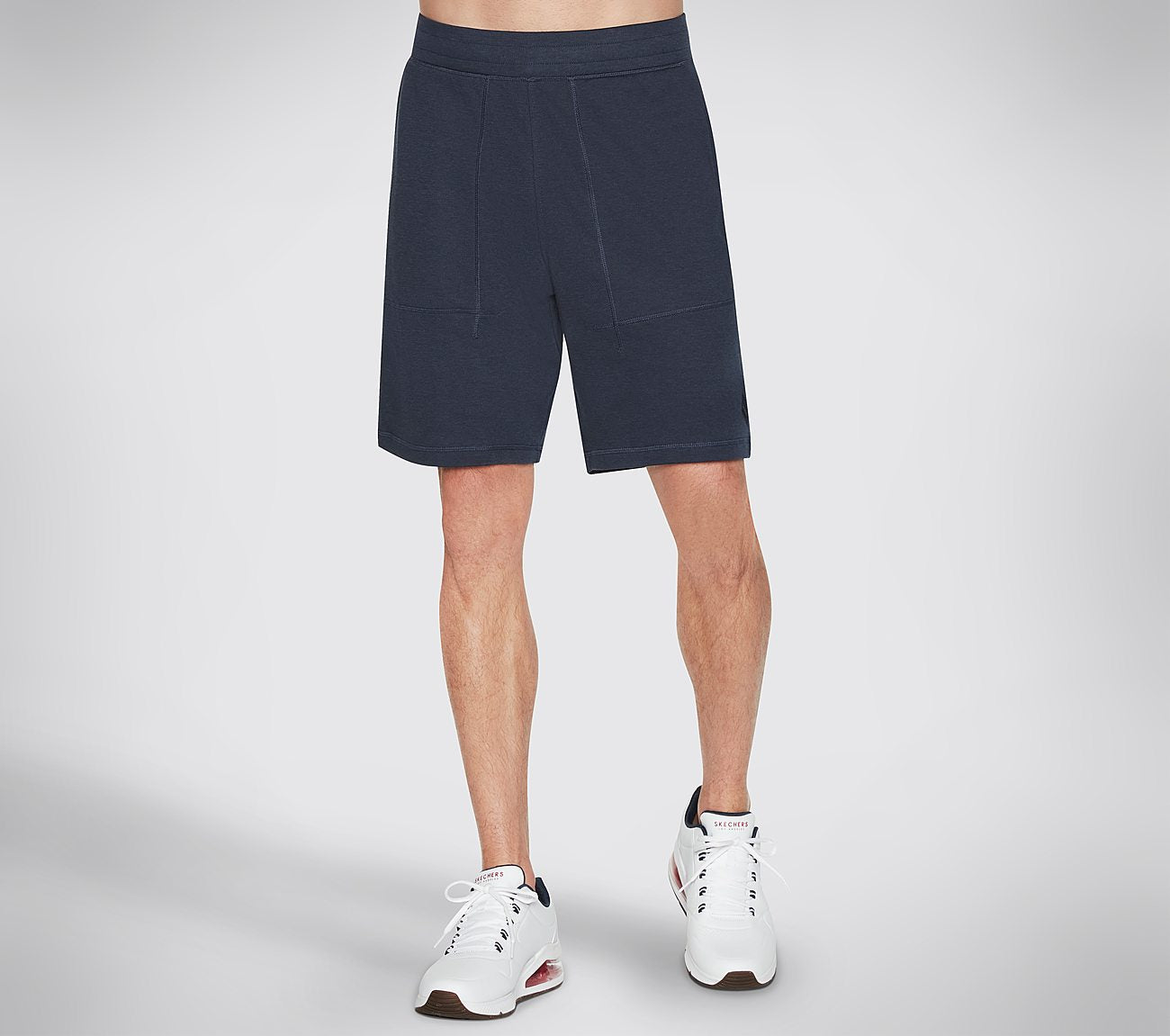 Side view of Skechers GOKnit Pique 9IN Men's shorts with modern fit and breathable design