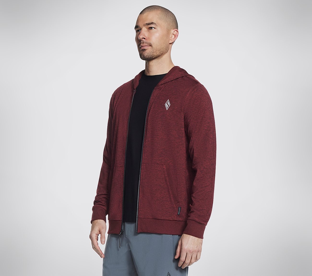 A front view of the Skechers Skech Knits Ultra Go Full Zip Jacket showcasing its sleek design and lightweight fabric, set against a simple and clean background