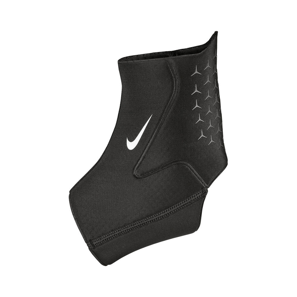 The image shows a unisex Nike ankle sleeve wrapped securely around an ankle, highlighting its supportive and flexible fit.