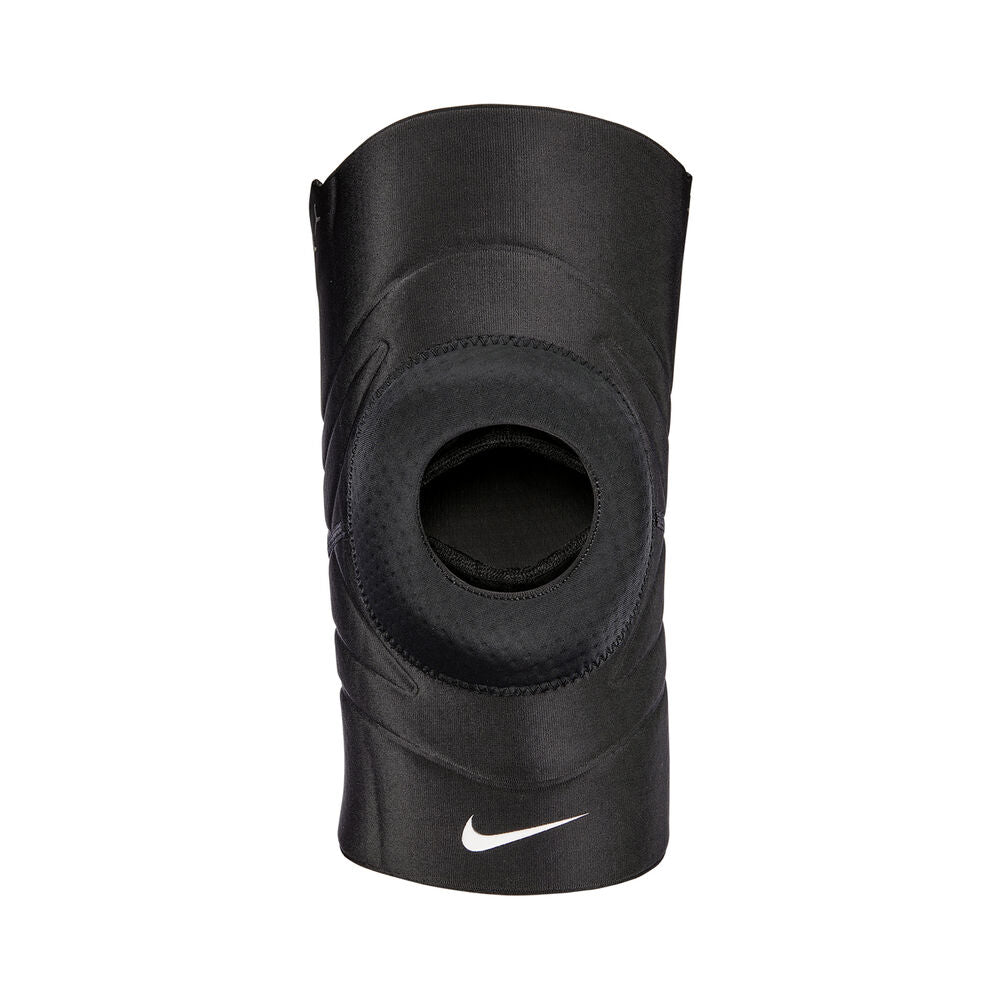 The image shows a unisex Nike knee sleeve snugly fitted on a knee, emphasizing its supportive and flexible design.