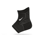 The image shows a unisex Nike ankle sleeve wrapped securely around an ankle, highlighting its supportive and flexible fit.