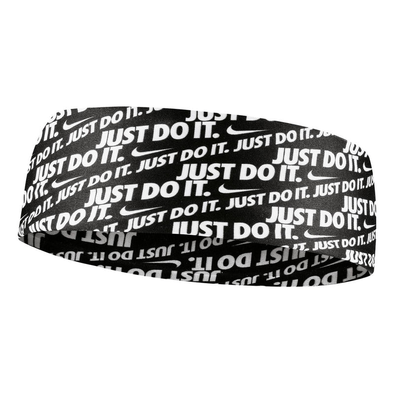 The image shows a unisex Nike headband worn on the head, showcasing its sleek, functional design and secure fit.