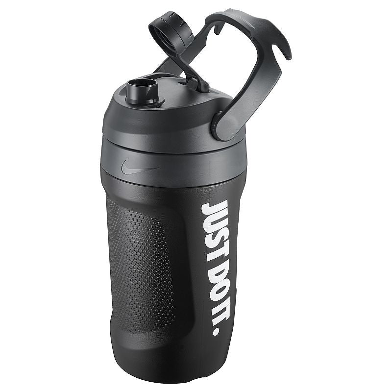 The image shows a large-capacity unisex Nike sipper bottle jug with a spill-proof cap, designed for easy hydration during workouts or outdoor activities.