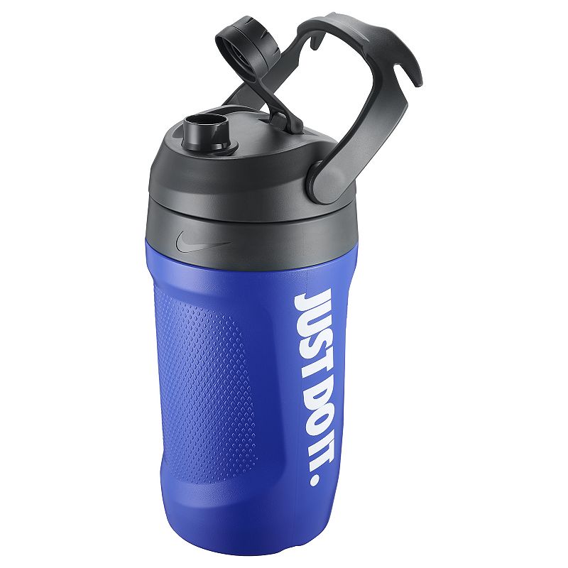 The image shows a large-capacity unisex Nike sipper bottle jug with a spill-proof cap, designed for easy hydration during workouts or outdoor activities.