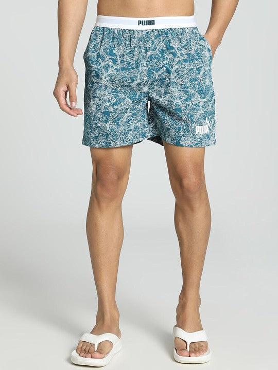 Side view of PUMA Men's Inner Wear Shorts, showcasing the soft fabric, snug fit, and PUMA logo, designed for comfort and flexibility in everyday or active wear.