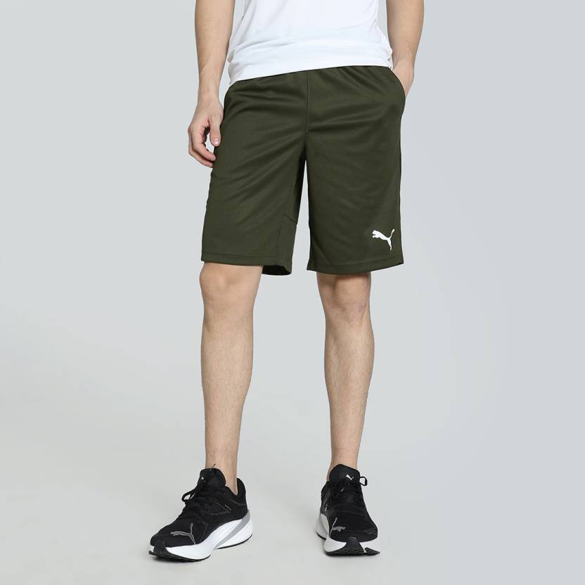 Side view of PUMA Men's Shorts, highlighting the relaxed fit, soft fabric, and signature PUMA logo for a comfortable and stylish casual look.