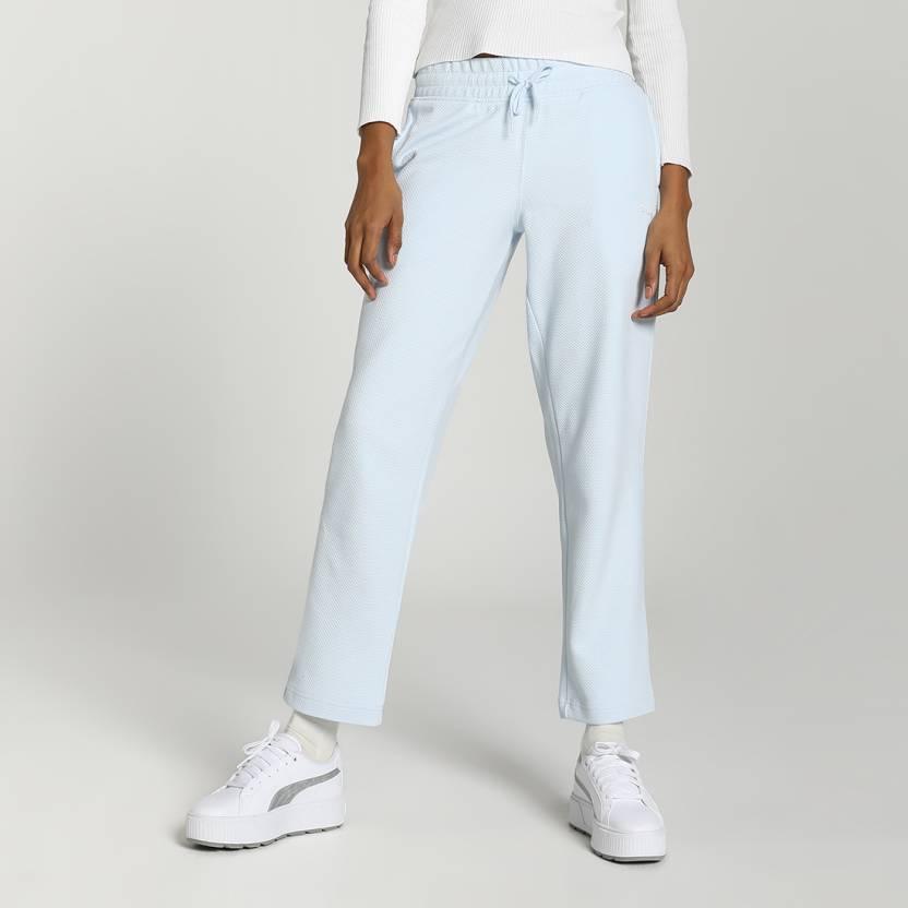 Side view of PUMA Women's Lower, highlighting the relaxed fit, soft fabric, and signature PUMA logo, perfect for casual wear and lifestyle activities.