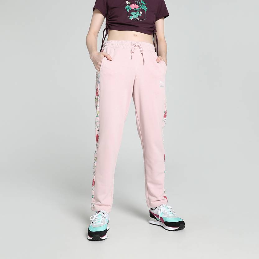 Side view of PUMA Women's Lower, highlighting the relaxed fit, soft fabric, and signature PUMA logo, perfect for casual wear and lifestyle activities.