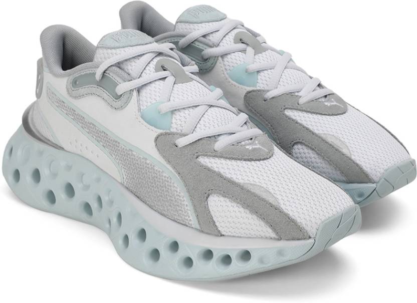 Side view of PUMA Women's Lifestyle Lace-Up Sneakers, showcasing the sleek design, breathable upper, cushioned insole, and iconic PUMA logo, designed for comfort and style in everyday wear.