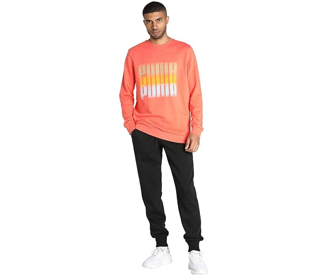 Front view of the PUMA Summer Squeeze Crew II in Salmon, showcasing the classic crewneck, soft fabric, and vibrant color with the logo.