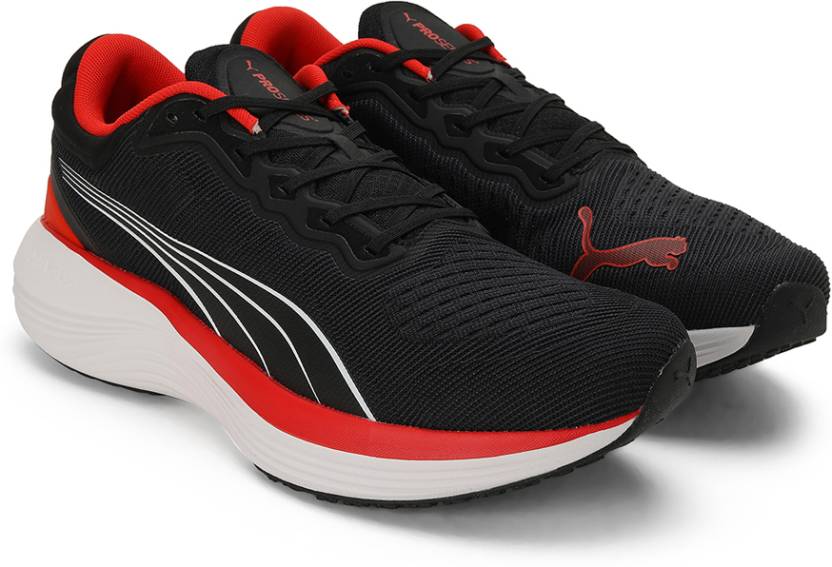 Side view of PUMA Men's Running Lace-Up Sneakers, showcasing the breathable upper, cushioned midsole, durable outsole, and iconic PUMA logo, designed for comfort and performance in running.