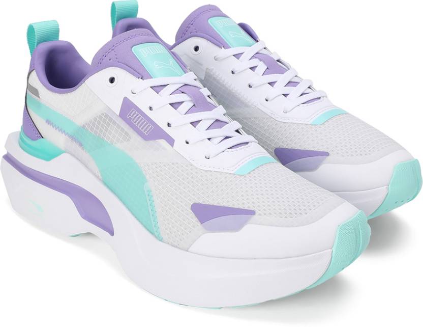 Side view of PUMA Women's Lifestyle Lace-Up Sneakers, showcasing the sleek design, breathable upper, cushioned insole, and iconic PUMA logo, designed for comfort and style in everyday wear.