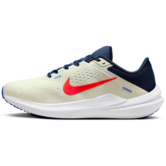 The image shows a pair of men’s Nike running shoes, emphasizing their sleek, lightweight design and supportive sole.