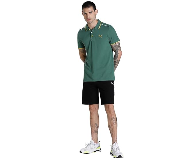 Front view of the PUMA Zippered Jersey Shorts, showcasing the zippered pockets, elastic waistband, and  logo against a sleek jersey fabric finish.