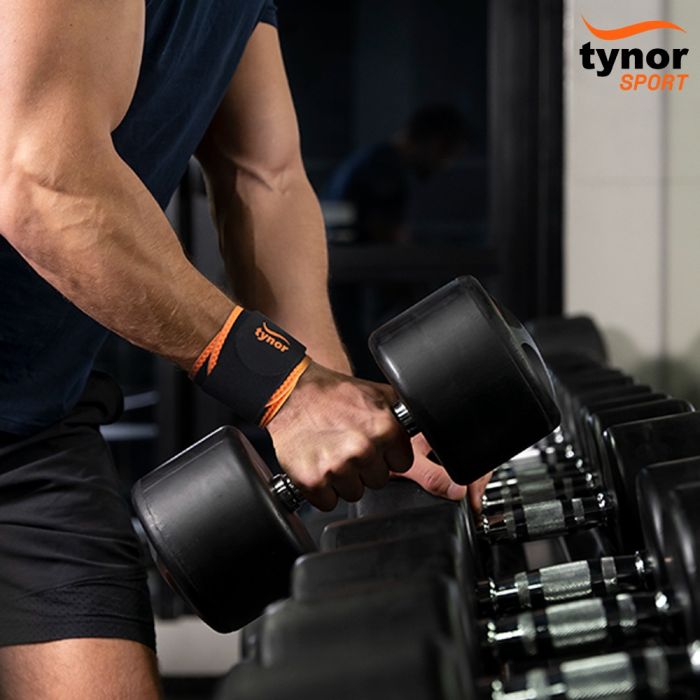 The image shows the Tynor Wrist Support (Neo) from a side angle, highlighting its ergonomic design, adjustable straps, and neoprene material that provides support and comfort during wear