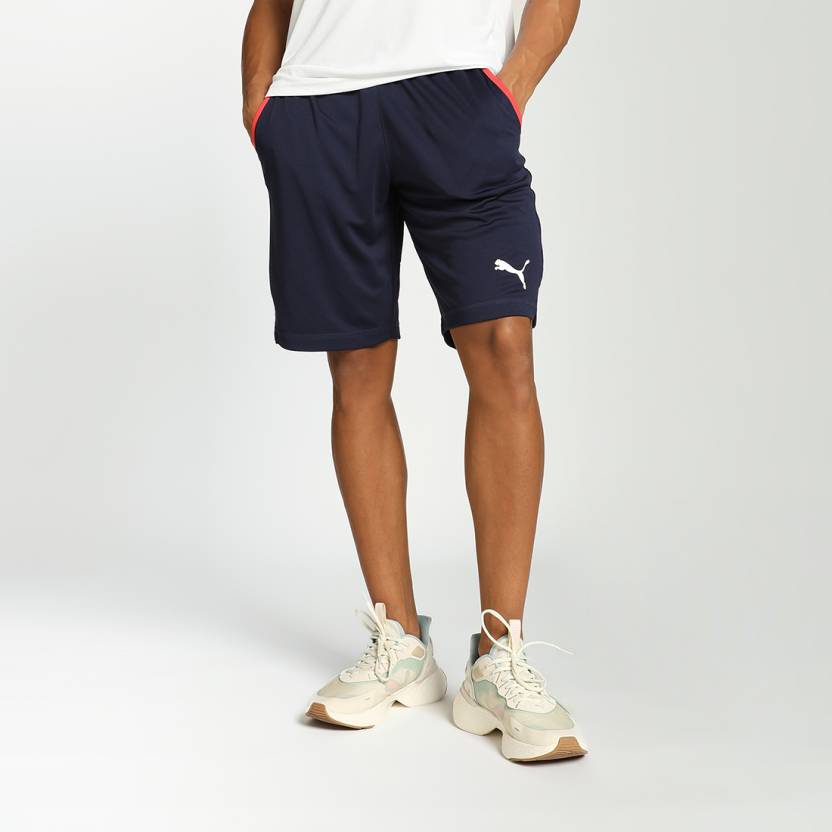 Side view of PUMA Men's Lower, showcasing its relaxed fit, breathable fabric, and signature PUMA logo for a casual, comfortable look.