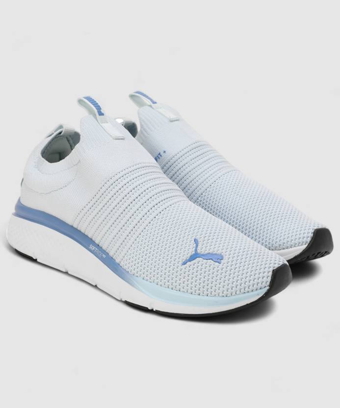 Side view of PUMA Women's Running Slip-On Sneakers, highlighting the breathable upper, cushioned midsole, durable outsole, and iconic PUMA logo, designed for comfort and performance in running and active wear.