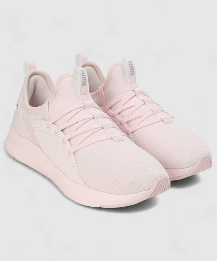 Side view of PUMA Women's Running Lace-Up Sneakers, showcasing the breathable upper, cushioned midsole, durable outsole, and iconic PUMA logo, designed for comfort and performance in running.