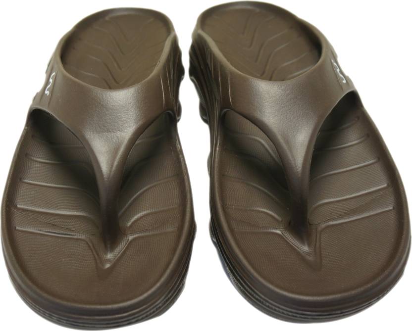 Doubleu Slipper displayed from various angles, featuring adjustable straps, cushioned footbed, and stylish design