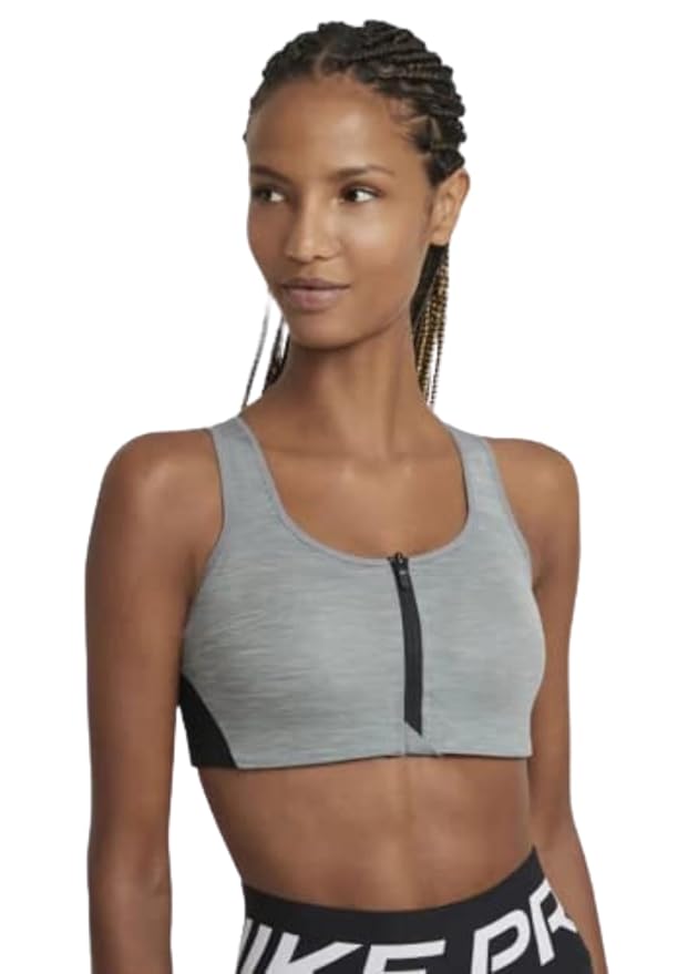 Side view of the NIKE AS W NK DF Shape Zip Front Bra in light grey, highlighting the zip-front design and breathable fabric for a supportive and comfortable fit.