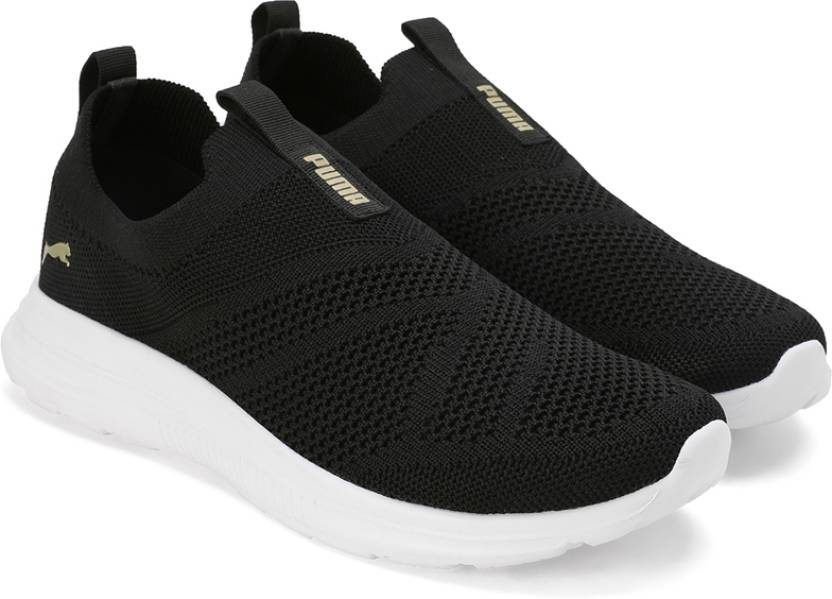 Side view of PUMA Women's Running Slip-On Sneakers, highlighting the breathable upper, cushioned midsole, durable outsole, and iconic PUMA logo, designed for comfort and performance in running and active wear.