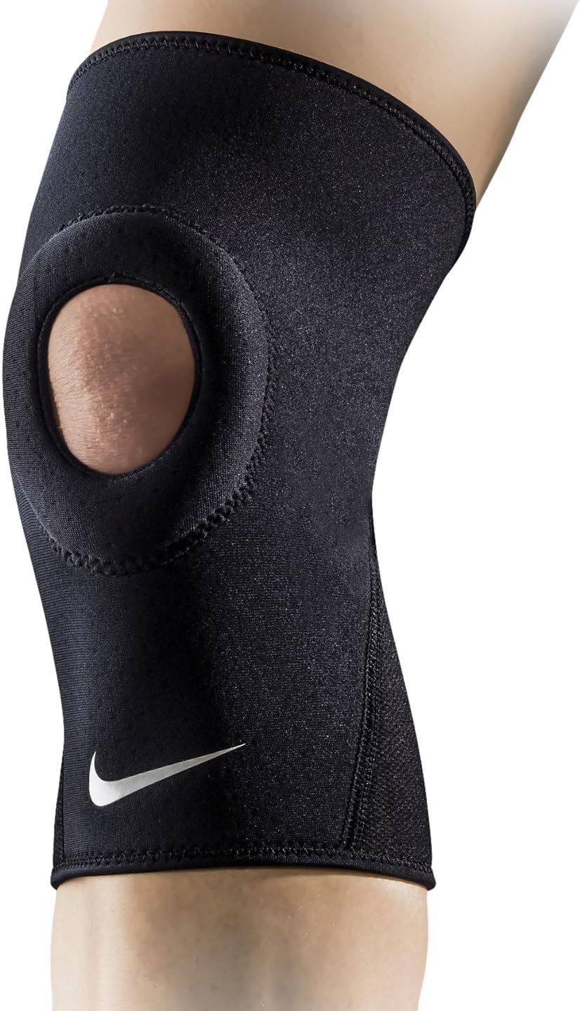 The image shows a unisex Nike knee sleeve snugly fitted on a knee, emphasizing its supportive and flexible design.