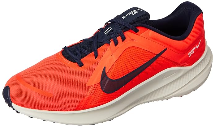 The image shows a pair of men’s Nike running shoes, emphasizing their sleek, lightweight design and supportive sole.