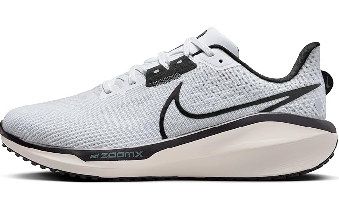 A dynamic side-angle view of Nike men’s lace-up running shoes highlighting the streamlined design, cushioned midsole, and bold Nike swoosh, set against a clean, sporty background