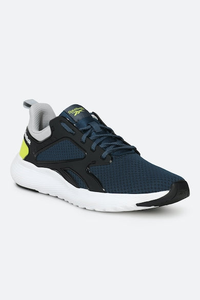 A sleek side view of the Reebok Fast Approach 2.0 showcasing its breathable upper, cushioned midsole, and durable outsole for men’s activewear needs.