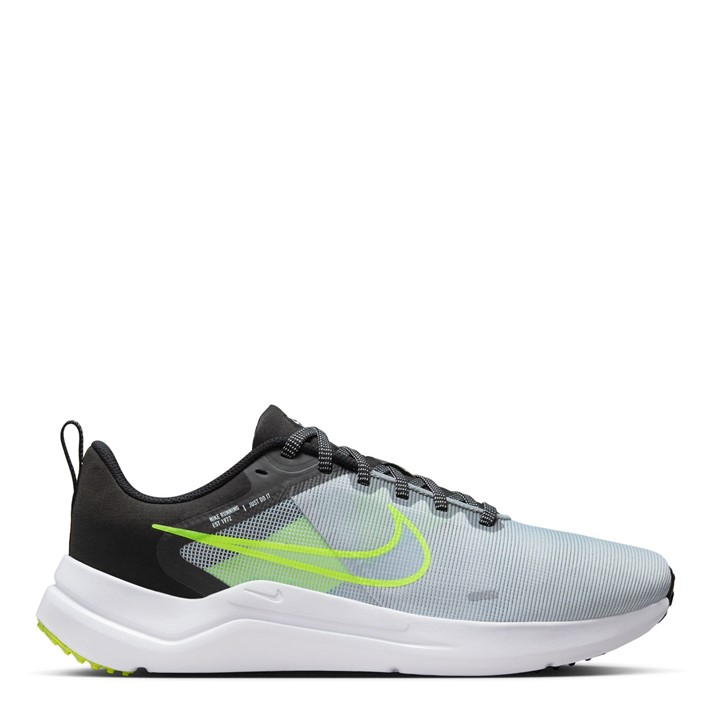 The image shows a pair of men’s Nike running shoes, emphasizing their sleek, lightweight design and supportive sole.