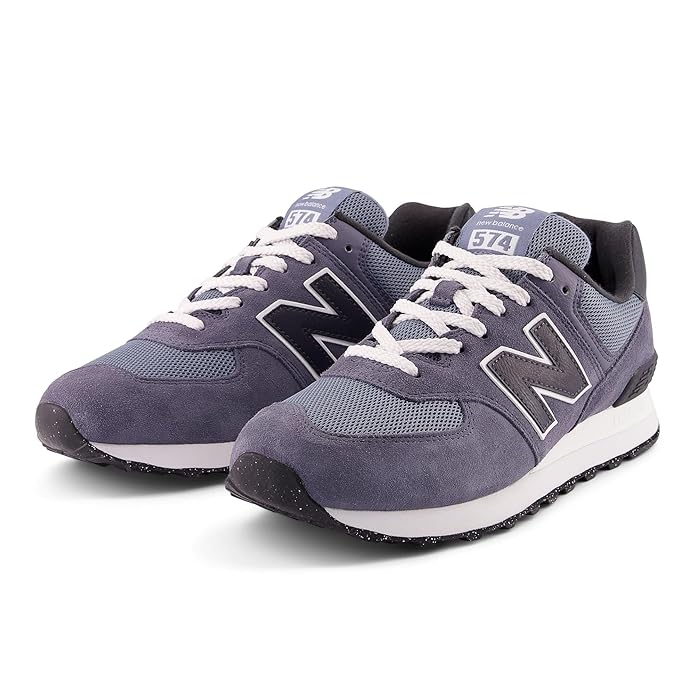 A side-angle view of New Balance men's lifestyle shoes showcasing the retro basketball-inspired design durable leather upper lace-up closure and premium craftsmanship placed on a clean background to highlight their unique features.