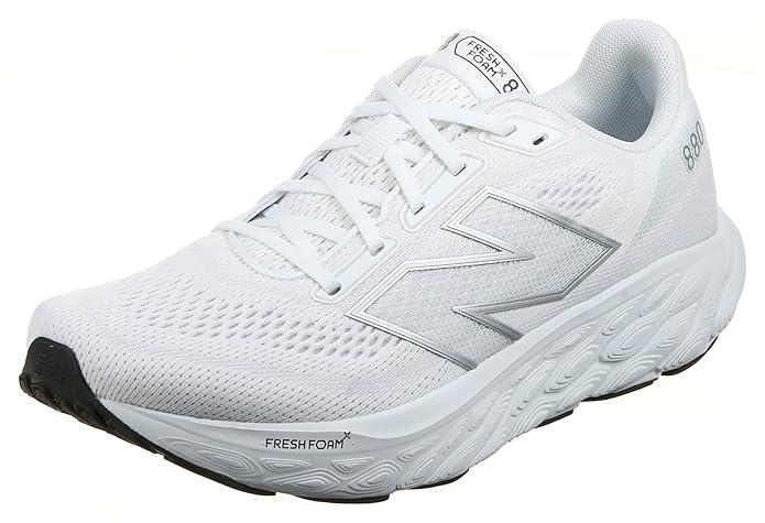 A side-angle view of New Balance men's running shoes highlighting the breathable mesh upper lace-up design and cushioned midsole placed on a clean background to emphasize their lightweight and athletic features.