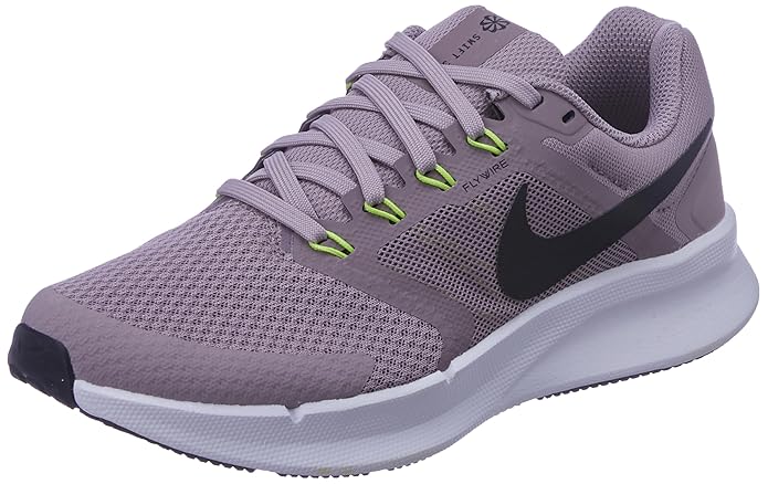 A side-angle view of Nike women’s lace-up running shoes showcasing the sleek profile, cushioned sole, and iconic Nike swoosh, set against a clean background for a modern look