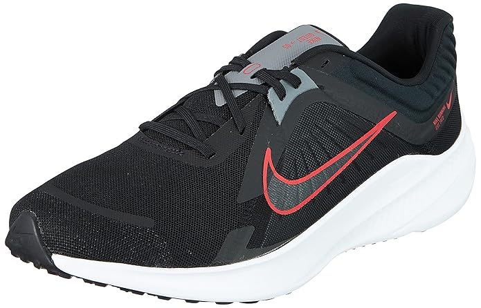 The image shows a pair of men’s Nike running shoes, emphasizing their sleek, lightweight design and supportive sole.